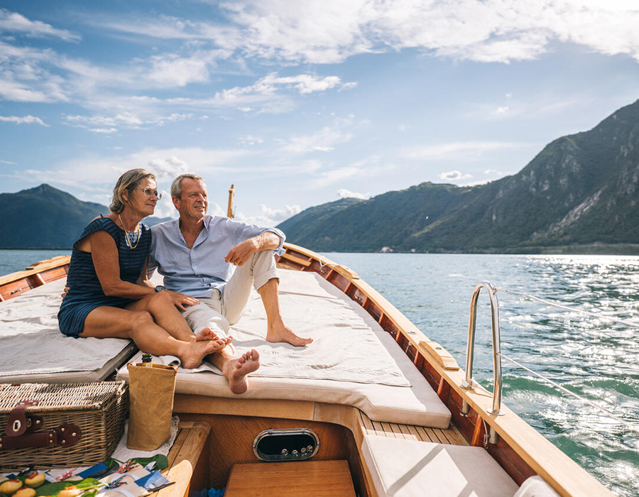 Retired couple relaxing on a boat on the water